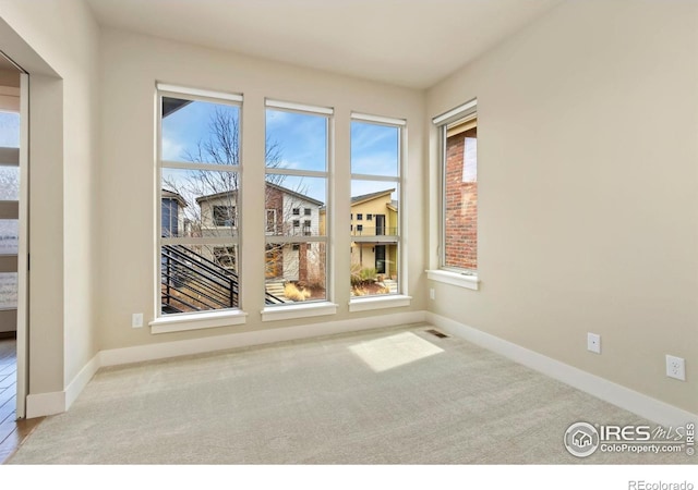 1658 Freewheel Dr, Fort Collins, CO 80525 - spare room with visible vents, baseboards, and carpet flooring