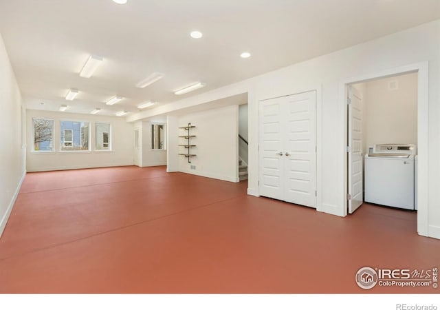 1658 Freewheel Dr, Fort Collins, CO 80525 - interior space featuring baseboards, recessed lighting, finished concrete flooring, stairs, and washer / dryer