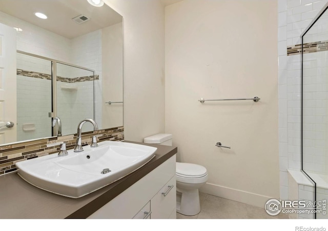 1658 Freewheel Dr, Fort Collins, CO 80525 - full bath with vanity, visible vents, toilet, a stall shower, and tile patterned floors