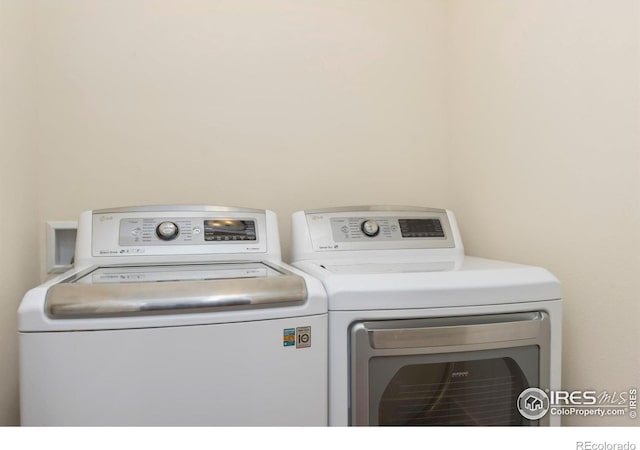 1658 Freewheel Dr, Fort Collins, CO 80525 - washroom with washer and clothes dryer and laundry area