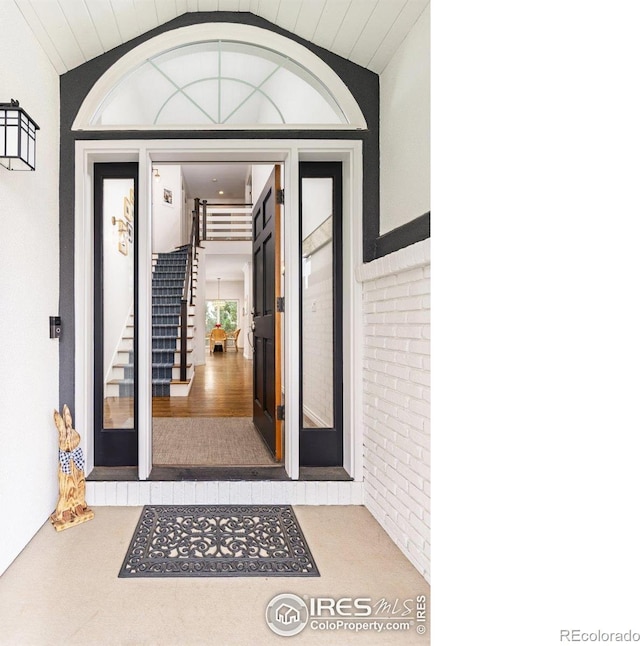 property entrance with stucco siding