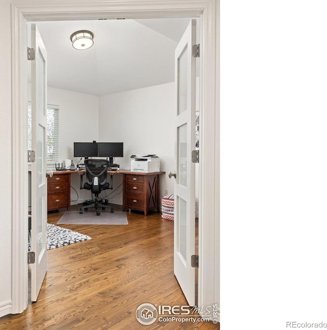 office space featuring french doors and wood finished floors