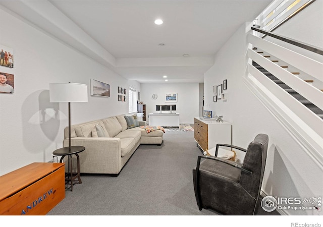 living area with recessed lighting, stairs, and carpet floors