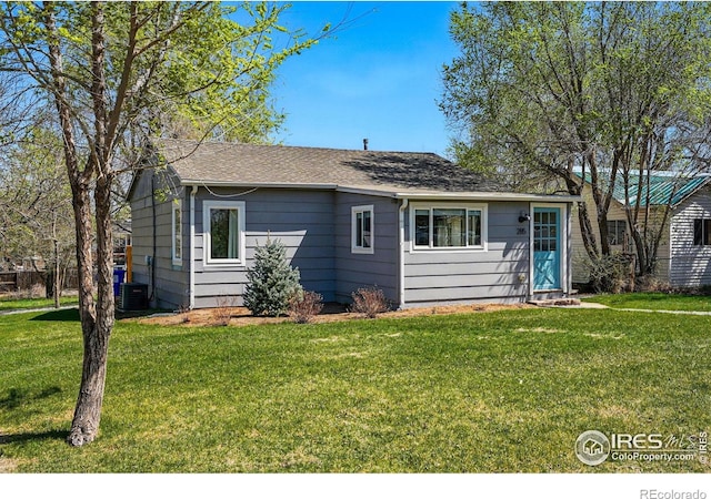 285 Holbrook St, Erie, CO 80516 - view of front facade with a front yard, central air condition unit, and roof with shingles