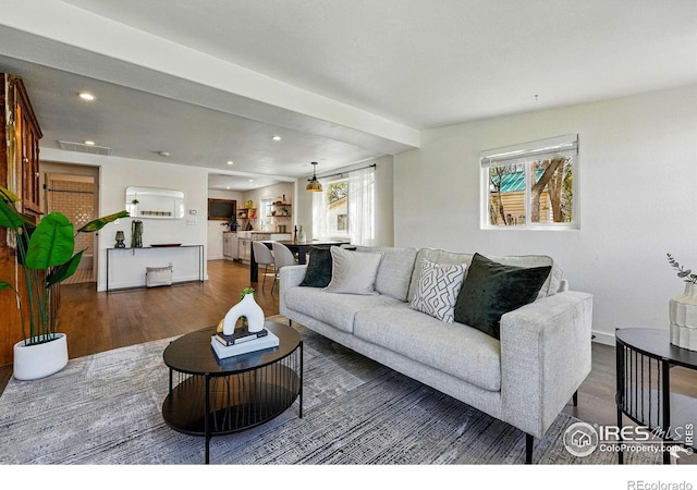 285 Holbrook St, Erie, CO 80516 - living area featuring recessed lighting, dark wood-type flooring, visible vents, and baseboards