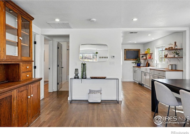 285 Holbrook St, Erie, CO 80516 - kitchen with dark wood-type flooring, visible vents, open shelves, and glass insert cabinets