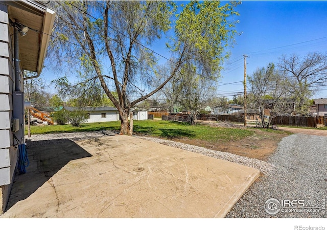 285 Holbrook St, Erie, CO 80516 - exterior space with a patio, fence, an outbuilding, and a storage unit