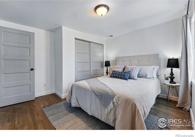 285 Holbrook St, Erie, CO 80516 - bedroom with visible vents, a closet, baseboards, and wood finished floors