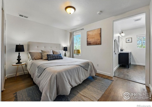 285 Holbrook St, Erie, CO 80516 - bedroom with wood finished floors, baseboards, and visible vents