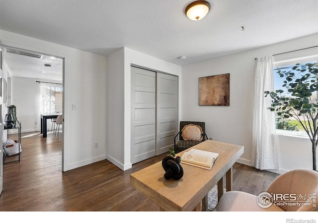 285 Holbrook St, Erie, CO 80516 - office space featuring dark wood-style flooring, visible vents, and baseboards