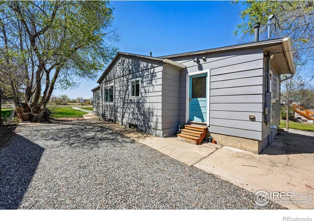 285 Holbrook St, Erie, CO 80516 - rear view of property with entry steps