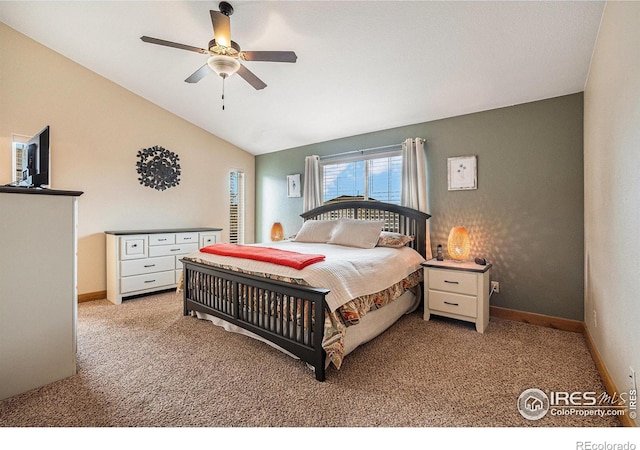 bedroom featuring light carpet, baseboards, a ceiling fan, and lofted ceiling