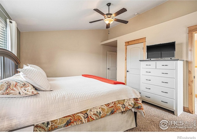 bedroom with light carpet, vaulted ceiling, and ceiling fan