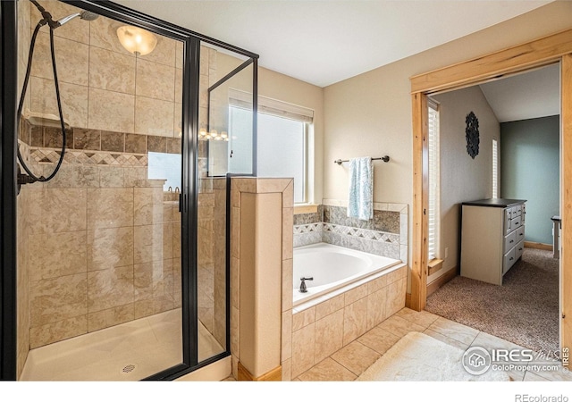 full bathroom featuring a shower stall, tile patterned floors, and a garden tub