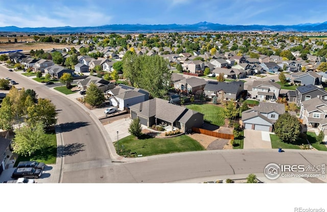 drone / aerial view with a mountain view and a residential view