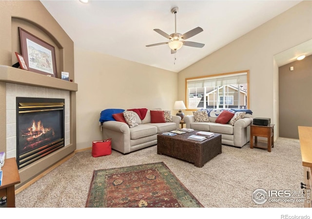 5151 Boardwalk Dr Unit K4, Fort Collins, CO 80525 - carpeted living room with a tile fireplace, a ceiling fan, and lofted ceiling