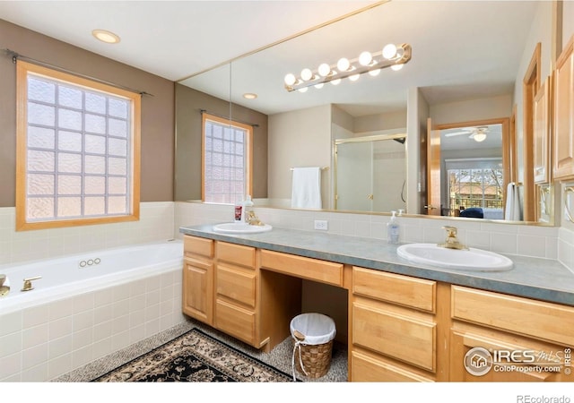 5151 Boardwalk Dr Unit K4, Fort Collins, CO 80525 - full bathroom featuring a sink, a bath, a shower stall, and double vanity