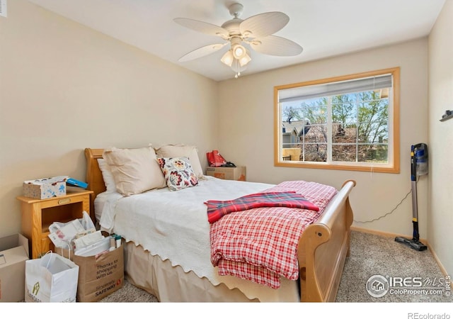 5151 Boardwalk Dr Unit K4, Fort Collins, CO 80525 - carpeted bedroom with baseboards and a ceiling fan