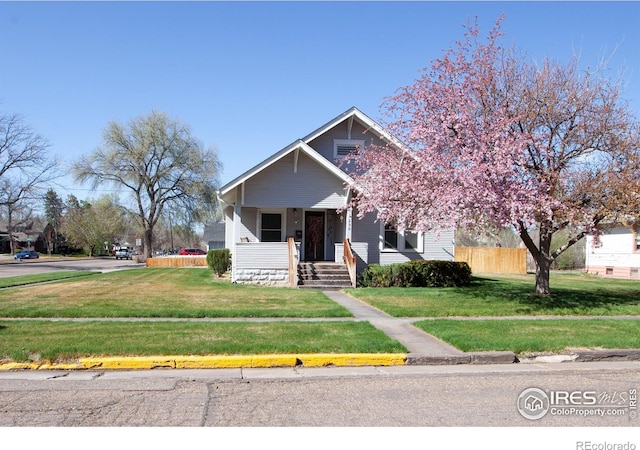 230 Beattie St, Sterling, CO 80751 - view of front of home featuring a front yard and fence