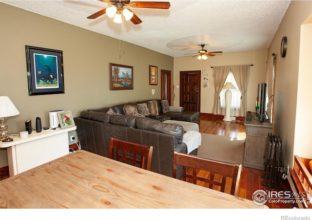 230 Beattie St, Sterling, CO 80751 - dining area featuring a textured ceiling, wood finished floors, and ceiling fan