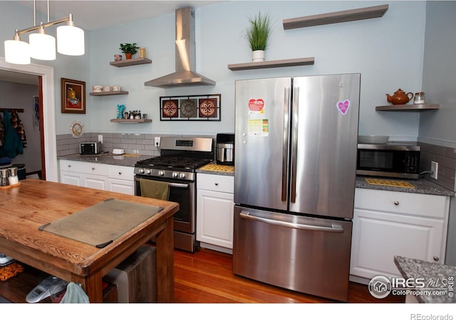 230 Beattie St, Sterling, CO 80751 - kitchen featuring white cabinetry, wall chimney exhaust hood, open shelves, and appliances with stainless steel finishes