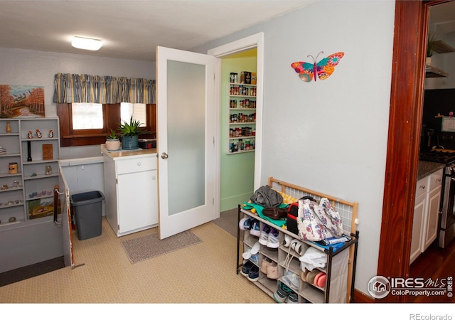230 Beattie St, Sterling, CO 80751 - kitchen with white cabinets and stainless steel range with gas cooktop