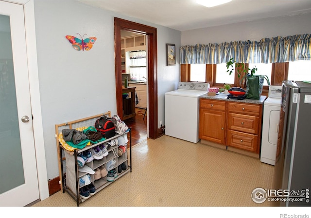 230 Beattie St, Sterling, CO 80751 - laundry area featuring independent washer and dryer and cabinet space