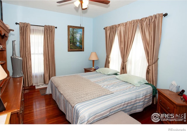 230 Beattie St, Sterling, CO 80751 - bedroom featuring a ceiling fan and wood finished floors