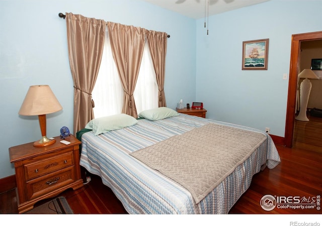 230 Beattie St, Sterling, CO 80751 - bedroom featuring wood finished floors and baseboards