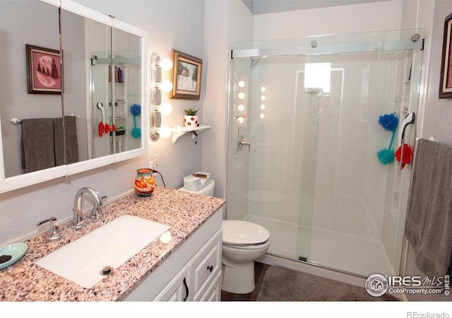 230 Beattie St, Sterling, CO 80751 - full bath featuring toilet, a stall shower, and vanity