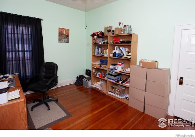 230 Beattie St, Sterling, CO 80751 - office area with baseboards and wood finished floors
