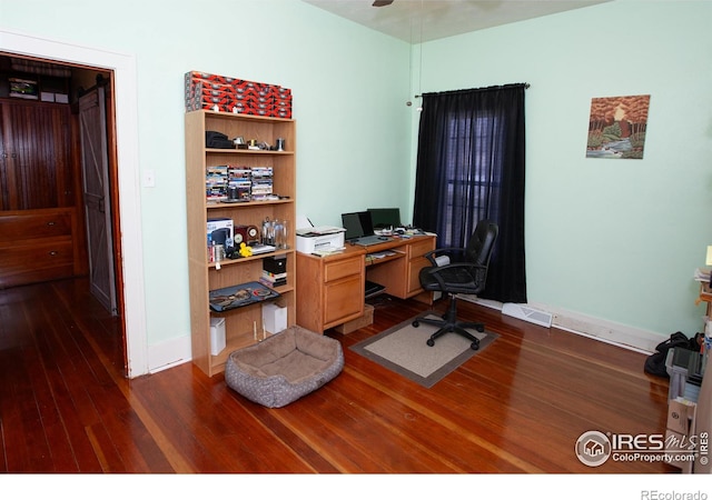 230 Beattie St, Sterling, CO 80751 - office space with ceiling fan, baseboards, and dark wood finished floors