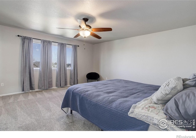 carpeted bedroom with a ceiling fan