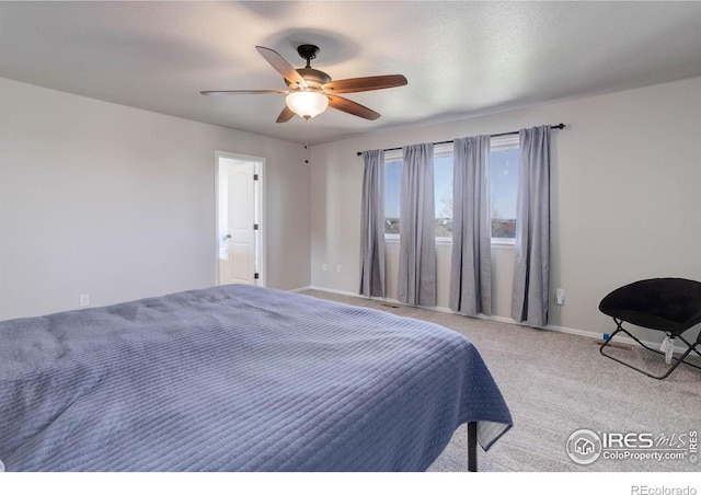 bedroom featuring ceiling fan, baseboards, and carpet floors
