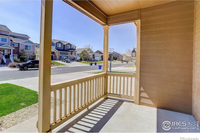 view of patio / terrace with a residential view and covered porch