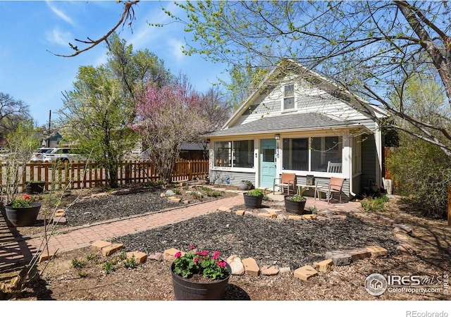 view of front of property featuring fence