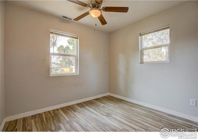 618 19th Ave, Greeley, CO 80631 - unfurnished room with baseboards, visible vents, ceiling fan, and light wood finished floors