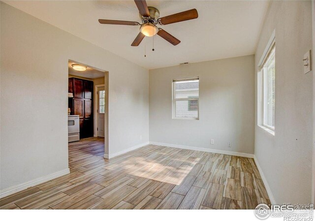 618 19th Ave, Greeley, CO 80631 - spare room featuring plenty of natural light, a ceiling fan, and light wood-style flooring