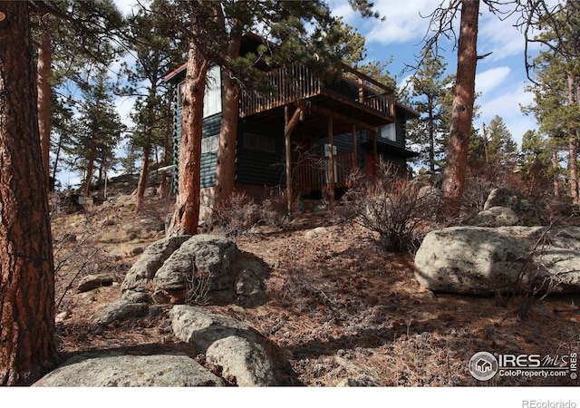 view of property exterior featuring a deck