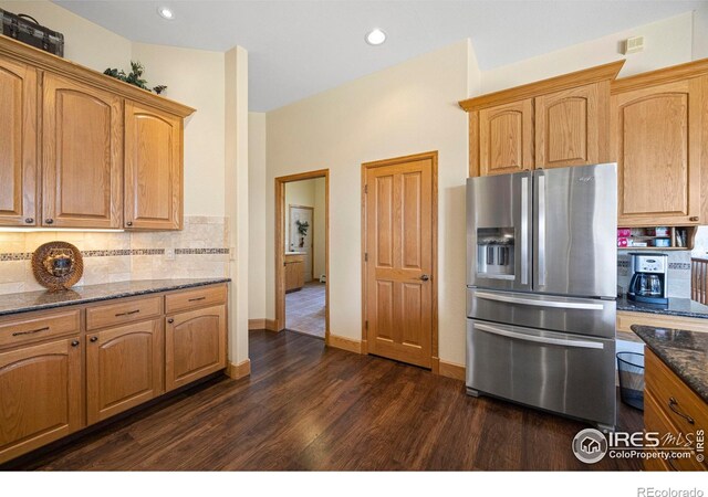432 Valley View Rd, Loveland, CO 80537 - kitchen with stainless steel refrigerator with ice dispenser, backsplash, dark stone countertops, and dark wood-style flooring
