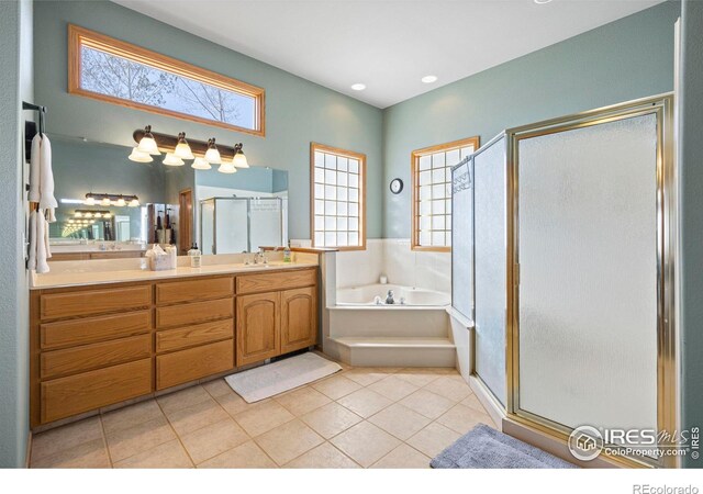 432 Valley View Rd, Loveland, CO 80537 - full bath with tile patterned flooring, a garden tub, vanity, and a stall shower