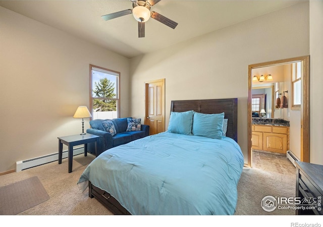 432 Valley View Rd, Loveland, CO 80537 - bedroom featuring a baseboard heating unit, light carpet, and connected bathroom