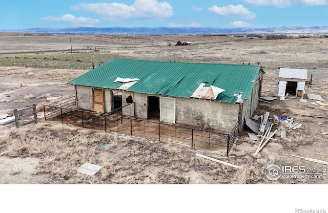 view of outdoor structure featuring a mountain view, an exterior structure, an outdoor structure, a rural view, and view of desert