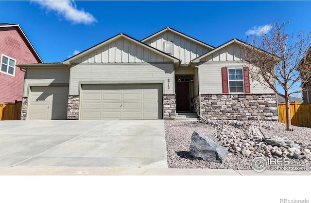3712 Daylily St, Wellington, CO 80549 - craftsman-style home with an attached garage, board and batten siding, driveway, and stone siding