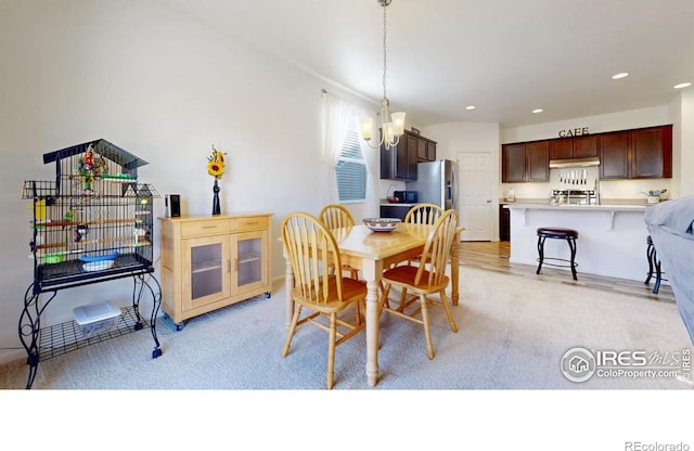 3712 Daylily St, Wellington, CO 80549 - dining room with recessed lighting, an inviting chandelier, and light carpet