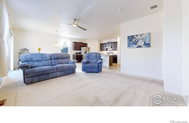 3712 Daylily St, Wellington, CO 80549 - living room with light carpet, baseboards, a ceiling fan, and visible vents