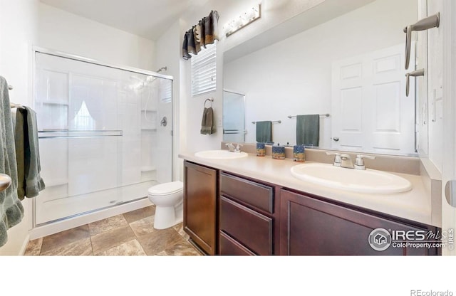 3712 Daylily St, Wellington, CO 80549 - full bath with toilet, a stall shower, double vanity, and a sink