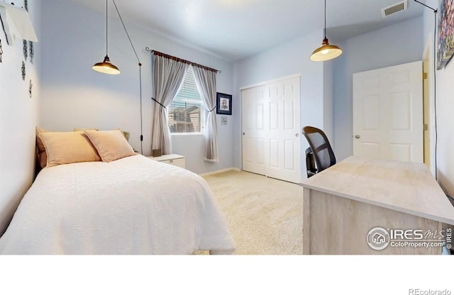 3712 Daylily St, Wellington, CO 80549 - bedroom featuring a closet, light colored carpet, baseboards, and visible vents