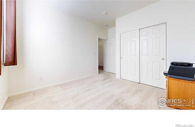 3712 Daylily St, Wellington, CO 80549 - unfurnished bedroom with light carpet, a closet, and baseboards