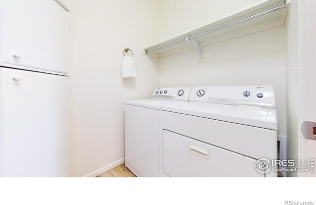 3712 Daylily St, Wellington, CO 80549 - laundry room with baseboards, washer and dryer, and laundry area